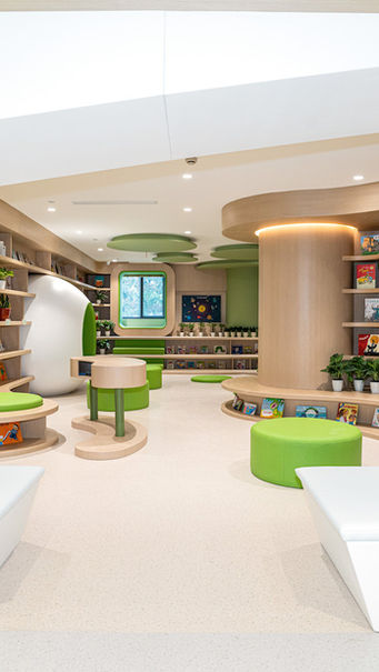 LIBRARY, KINDERGARTEN DESIGN
Kindergarten library interior designed by MAD Studio, showcasing innovative architecture and design. The library features curved wooden bookshelves, vibrant green seating areas, and minimalist plant decor, creating an inviting and tranquil environment for readers. Ideal for educational and community spaces.