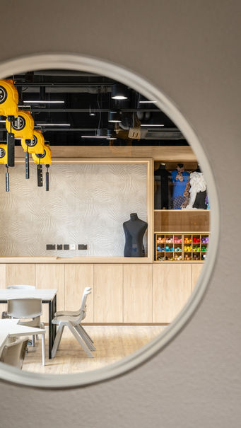 D&T Workshop, VSA, Kindergarten Design
Modern interior design studio featuring a creative workspace with sleek furniture, warm wooden accents, and vibrant decor elements. The room includes a mannequin and organized storage shelves, perfect for artistic projects. Ideal space for innovative design solutions and stylish studio inspiration.