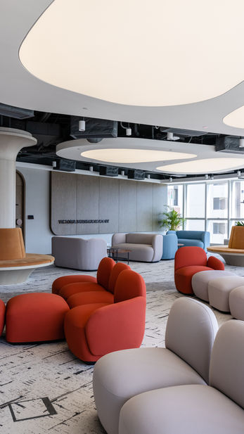 The Quay, VSA, Commercial Interior Design
Modern interior design by Mad Studio showcasing a stylish school lounge. Features contemporary furniture with vibrant red and neutral-toned modular seating, sleek architectural lighting, and natural elements. Ideal for educational spaces.