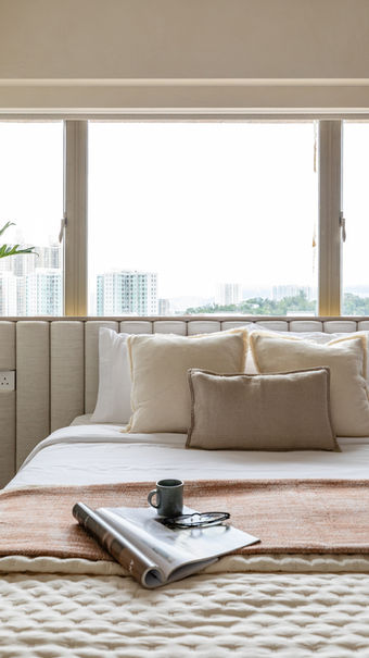 Cosy bedroom, salmon bed cover, coffee on magazine, indoor plants, cushioned headboard, wooden panel, Jumbo Court, Broadcast Drive, Residential interior design